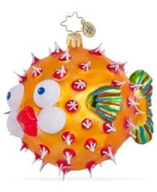 Bursting with holiday joy, the Puff a Kiss ornament from Christopher Radko is dotted with red and white and puckering up under the mistletoe in handcrafted glass.