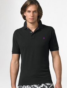 The custom fit cotton mesh polo is cut slimmer and shorter than the original. It is finished with a two-button placket, banded sleeves, uneven vented hem and an embroidered pony. Machine wash Imported