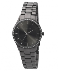 A sultry, smoky watch by Skagen Denmark. Charcoal stainless steel bracelet and round case. Bezel crystallized by Swarovski elements. Charcoal dial with silvertone stick indices and logo. Quartz movement. Water resistant to 30 meters. Limited lifetime warranty.