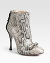 Exude confidence in this scintillating design of genuine python and suede, topped with a petite bow. Suede-covered heel, 4¼ (110mm)Python and suede upperBack zipLeather lining and solePadded insoleMade in ItalyOUR FIT MODEL RECOMMENDS ordering one half size up as this style runs small. 