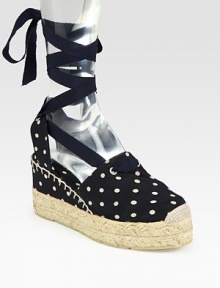 Polka-dot print silk with an espadrille platform and a textured grosgrain ribbon that ties up the ankle. Self-covered and hemp wedge, 3 (75mm)Hemp platform, 1 (25mm)Compares to a 2 heel (50mm)Printed silk and grosgrain ribbon upperLeather liningRubber solePadded insoleMade in SpainOUR FIT MODEL RECOMMENDS ordering true size. 