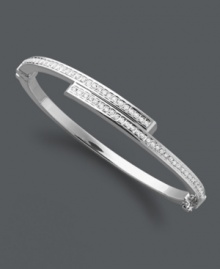 Sparkling sophistication. This subtly shimmering style features a unique bypass design accented by round-cut diamonds. Set in sterling silver with a slip-on hinge clasp. Approximate length: 7 inches.