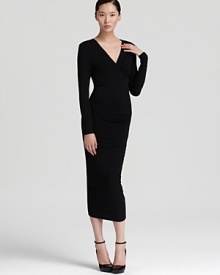 Slip into this minimalist Donna Karan New York dress and make a major impact in the ruched silhouette. A bubble hem adds a unique touch to the wardrobe staple, featuring with draped v neckline.