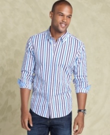 A slim design and vertical stripes give this Calvin Klein button down shirt a flattering and fashionable fit.