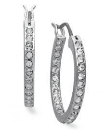 Classic elegance, inside and out. These hoop earrings from Swarovski illuminate all occasions with clear crystal pave. Crafted in rhodium-plated mixed metal. Approximate diameter: 3/4 inch.