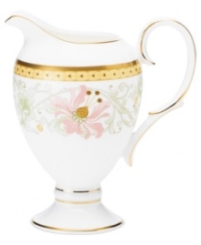 East meets West in the ornate Blooming Splendor creamer by Noritake. A Japanese-inspired pattern with raised dots pairs with intricate florals rooted in white bone china.