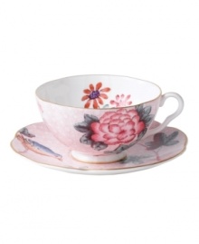 Delight in the tradition of English tea with the Cuckoo teacup and saucer set, featuring Wedgwood bone china adorned with gold bands, fanciful birds and vintage blooms. With scalloped detail.