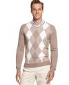 Traditional argyle golf sweater by Greg Norman for Tasso Elba Golf will keep you warm during early tee times.