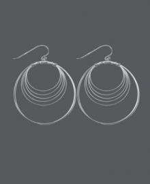 Get style that's out of this orbit! Chic, circular earrings by Unwritten feature a wire wrap design crafted in sterling silver. Approximate drop: 2-1/4 inches.