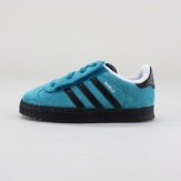 Scaled down for a toddler's tiny stride, this seasons adidas Originals Gazelle 2.0 shoes step baby into an iconic soccer style made from super-smooth suede. Features a hook--and-loop closure with elastic laces for easy-on, easy-off convenience. Imported.