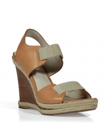 American style from Michael Kors comes to your summer wardrobe with these stylish wedge sandals - Made from light brown leather, woven linen and natural-textured braided jute trim - Dark wood wedge heel - Pair with sundresses, carpis or sexy denim cut-offs