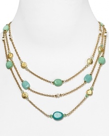 Embellished with striking turquoise beads and hammered stations, Lauren Ralph Lauren's link necklace is a striking adornment. Layer it over a crisp collar for a cool contrast.