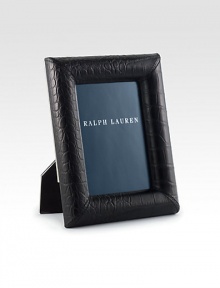 Crafted from elegant leather, this single-photo frame exudes modern polish with an embossed croc pattern.Embossed leatherNickel-plated brass detailing on back of frame7.75 X 9.75 X 1.6Fits 5 X 7 photosImported