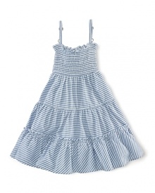 A stylish striped jersey dress is updated with smocked detailing and a pretty flared silhouette.