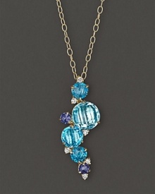 A brilliant fall of faceted iolite, blue topaz and diamond adds bright color to gleaming 18K yellow gold. By Carelle.