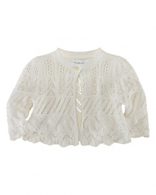 An ultra-soft cotton cardigan is knit in a delicate pointelle design with ruffled trim.