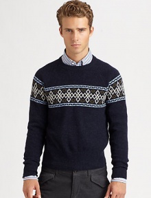 A modern style Nordic print pattern defines the body and shoulders of a cozy sweater knitted in superior wool.CrewneckRibbed knit collar, cuffs and hemWoolDry cleanImported