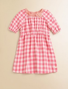 Rendered in pure cotton, this soft and sweet gingham print frock is perfect for school, play or a party.Ruched crewneck with bowShort puffed sleeves with elastic cuffsElastic waistShirttail hemCottonMachine washImported