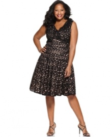 Adrianna Papell's plus size dress pops with a gorgeous lace overlay, made even more dramatic by a neutral lining and pretty crisscrossing pleating at the bust.