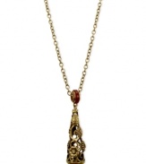 Ornate opulence. T Tahari's pendant necklace, part of the Deco Lace Collection, is crafted from gold-tone mixed metal with red glass crystal and Bordeaux accents for a stunning effect. Approximate length: 36 inches. Approximate drop: 3-1/8 inches