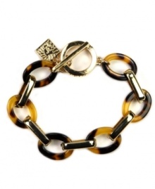 Get linked in. A single strand of gold-tone links mingle with tortoise shell for classically-styled confidence. Slip on this ever-chic flex design from Anne Klein with ease. Set in gold-tone mixed metal with toggle closure. Approximate length: 7-1/2 inches.