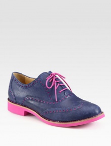 Candy-colored hues brighten this timeless leather oxford with wingtip details. Rubber heel, 1 (25mm)Leather upperLeather liningRubber solePadded insoleImported