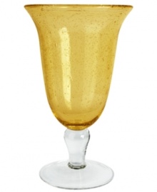 The eye-catching Iris iced tea glass makes a big impact in any setting with a fresh citrine color and tiny bubbles trapped in dishwasher-safe glass. From Artland.