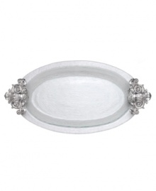 Hold court with the regal elegance of Fleur de Lis serveware. Ornate handles featuring the iconic French lily evoke another era, gleaming spectacularly on this magnificent glass platter from Arthur Court.