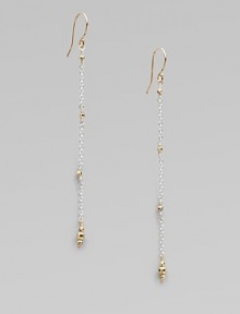 Gracefully dangling strands of sterling silver chain, sprinkled and tipped with glowing faceted beads of 14k gold.14k yellow gold and sterling silverLength, about 2¼Ear wireMade in USA