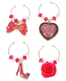 Party pleaser. You'll never lose your wine glasses in a crowd with this four-piece charm set from Betsey Johnson. Crafted from gold-tone mixed metal, and featuring whimsical designs and glittery glass accents. Items come packaged in a signature Betsey Johnson Gift Box. Approximate drop, shoe charm: 1 inch; heart charm: 1 inch; flower charm: 3/4 inch; bow charm: 3/4 inch.