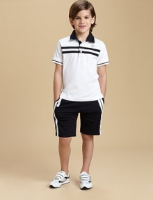 Sporty stripes, perfectly placed on soft cotton knit for a look of sophisticated ease. Polo:Polo collar with logo and microstriped liningButton placketShort sleeves with ribbed color-tipped cuffsChest stripes and front logoEven side vented hem Shorts:Elasticized pull-on waistSide racing stripesOne back patch pocket with logoCottonMachine washImportedPlease note: Number of buttons may vary depending on size ordered. 