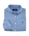 A handsome long-sleeved sport shirt is rendered in crisp gingham woven cotton broadcloth.