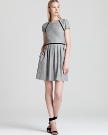 Classic tweed gets a fashion-forward lift from chic black piping on this Tibi dress, touting an of-the-moment pleated skirt. Polished for workdays, it doubles as a dinner option when you add strappy heels.