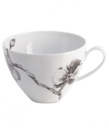 Compose a striking arrangement with the Black Orchid breakfast cup by Michael Aram. Fine white Limoges porcelain flourishes under a dark watercolor motif inspired by foliage from around the world.