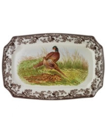 Bring the classic style of the English countryside to your table with the Woodland Collection. This traditionally patterned rectangular platter features the majestic pheasant framed by Spode's distinctive British Flowers border, which dates back to 1828.