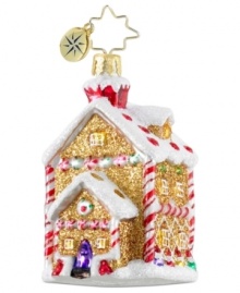 A sweet treat. Crafted of luxe gold sparkles, minty candy canes and fruity gum drops, this ornament from Christopher Radko exudes holiday cheer upon your tree. Sugary sparkles drape the house in frosty snow.