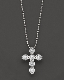 Diamond cross pendant in white gold formed from a gleaming cluster of orbs, with ball chain.