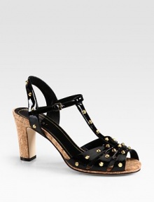 Patent leather silhouette with goldtone studs and a cork heel. Cork heel, 3 (75mm)Patent leather upper with metal studsAdjustable ankle strapLeather lining and solePadded insoleMade in Italy