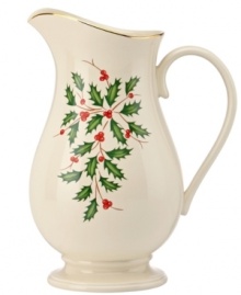 Perfect for entertaining, this porcelain pitcher is trimmed with gold and a holly motif to match the beloved Lenox Holiday dinnerware collection.