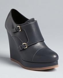 These Jil Sander booties feature distinctive buckled panels that take basic wedges to a higher plane.