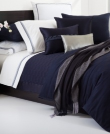 This Windsor Navy quilted sham from Hugo Boss turns your bed into an oasis of tranquility. 350-thread count cotton sateen and silk textures provide endless comfort. Zipper closure.