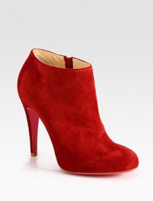 Lifted by a self-covered heel, soft suede shapes a sophisticated, side-zip ankle boot. Self-covered heel, 4 (100mm)Suede upperSide zipperLeather liningSignature red leather solePadded insoleMade in ItalyOUR FIT MODEL RECOMMENDS ordering true size. 