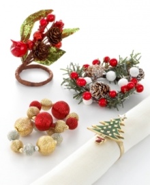 Beacons of shimmer and shine, these beaded napkin rings from Excell feature alternating gold and red or silver baubles with a festive metallic finish. Shown bottom left. (Clearance)