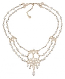 A true dazzler. Embellished with glittering stone accents and glass pearls, you'll strike a chord in this swag frontal necklace from Carolee. Crafted in gold tone mixed metal. Approximate length: 17 inches + 2-inch extender.