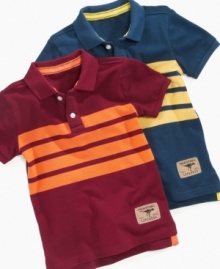 Because your little explorer is always turning up something to surprise you, dress him a striped polo from Greendog Kids with its Prehistoric Explorer patch.