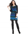 Amp up your look for fall with Spense's three-quarter-sleeve petite sweater dress, showcasing an alluring zig-zag print.