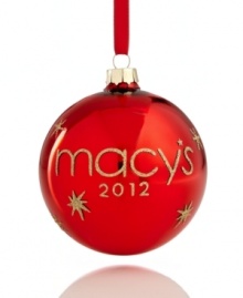 Make it memorable with the magic of Macy's and a brilliant red ball ornament adorned with dazzling gold glitter. Dated on reverse, too.