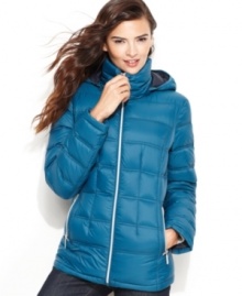 MICHAEL Michael Kors' lightweight (yet totally warm) puffer jacket can be worn alone or as a layering piece with longer coat. The matching pack-sack is perfect for an on-the-go lifestyle.