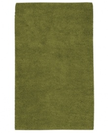 Add a fresh glow to any room with a rich, felted wool rug in leafy green. Hand-woven in India, this luxurious piece lets you in indulge in the supreme softness of plush New Zealand wool.