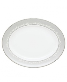 To entertain with grace and style look no further than this Bellina oval platter from Lenox's dinnerware and dishes collection. Elegant bone china with a delicate floral design and textured white beads is finished with platinum trim. Platter shown back. Qualifies for Rebate